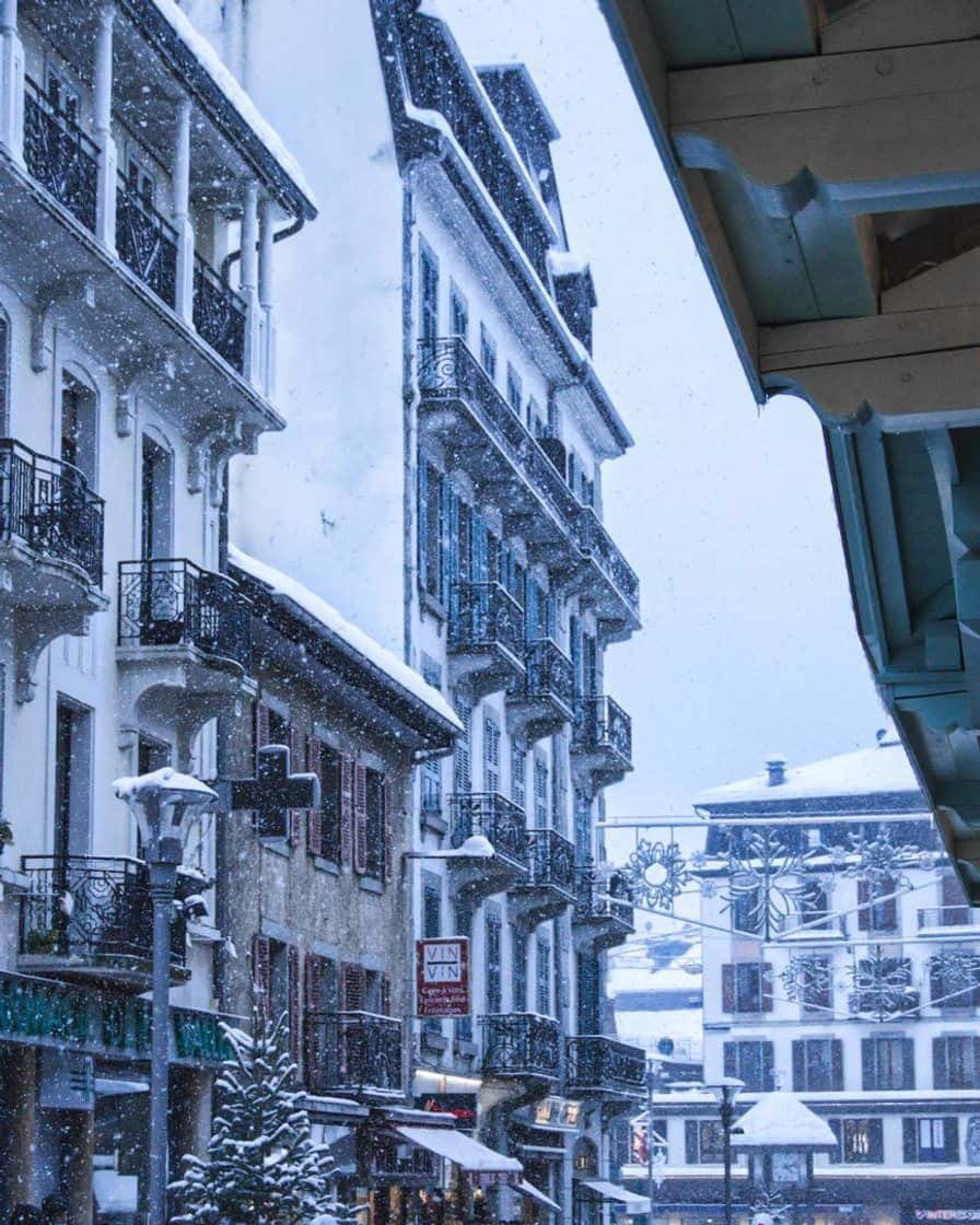 Snowy street in central Chamonix, old hotel façades under snow