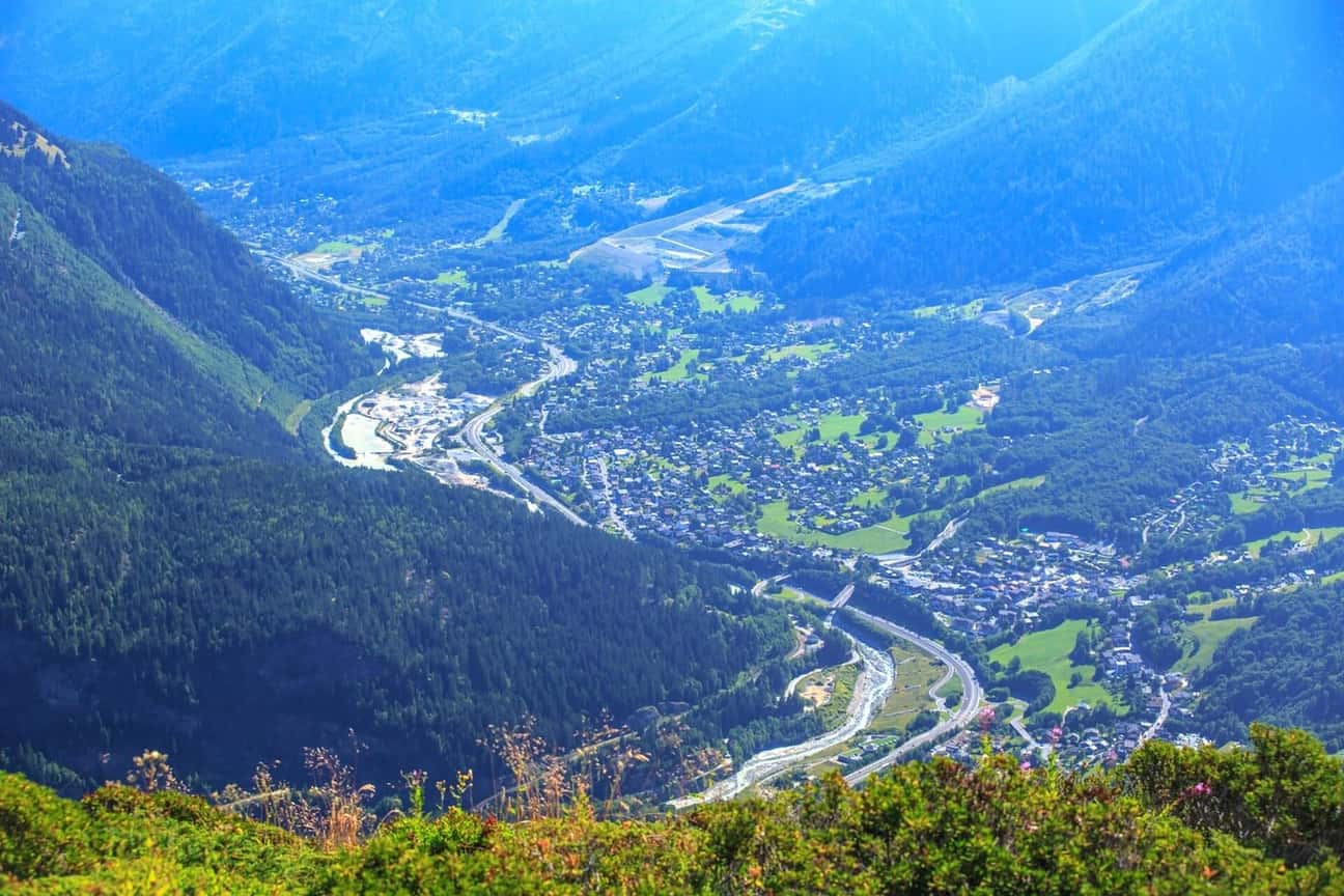 The Chamonix valley seen from the slopes above Les Houches, the road and the Arve running up towards Chamonix between forested mountainsides