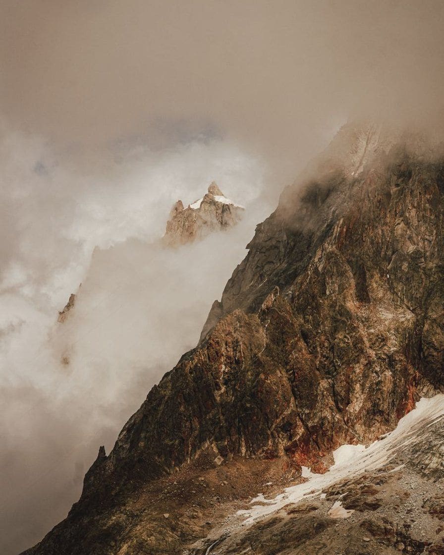 Mountain slopes wrapped in cloud above the valley