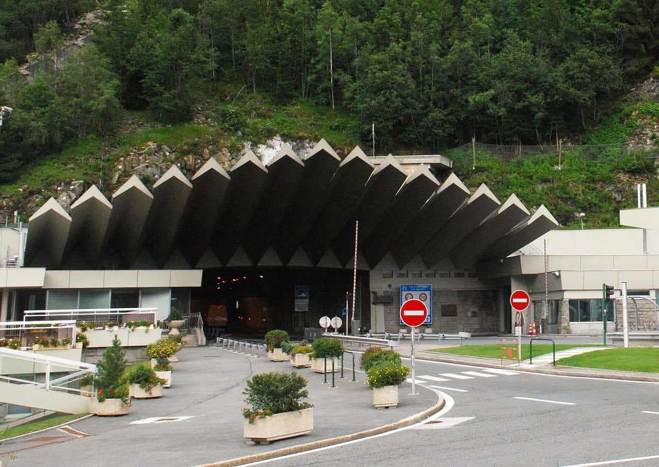 Entrance to the Mont Blanc Tunnel on the French side, its saw-toothed concrete canopy at the foot of the forest